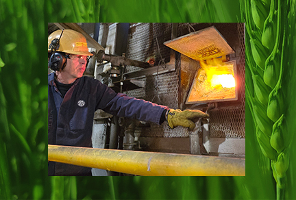 Male employee at Ardagh Glass Packaging checking a furnace